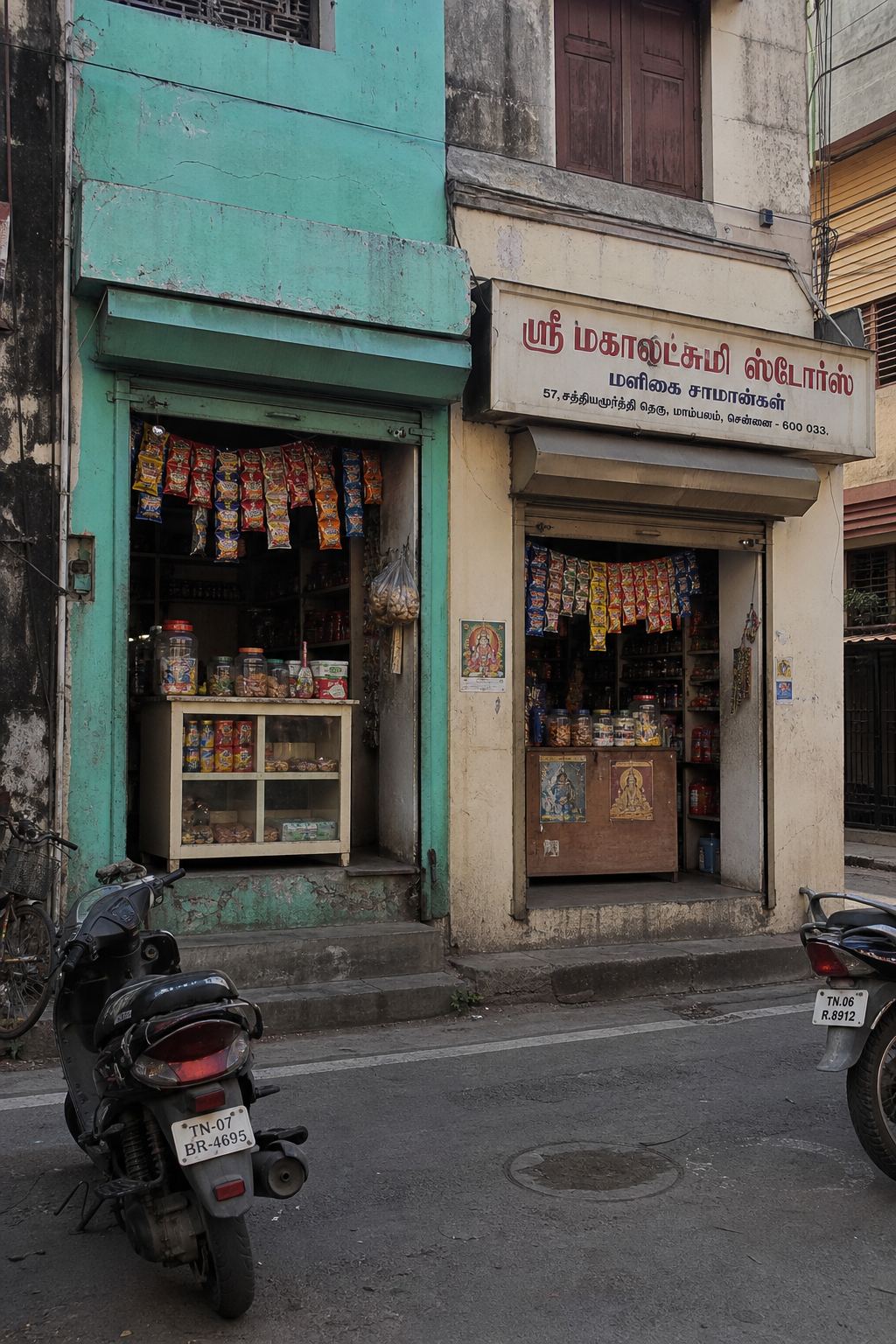 Two small shopfronts on a Chennai residential street.