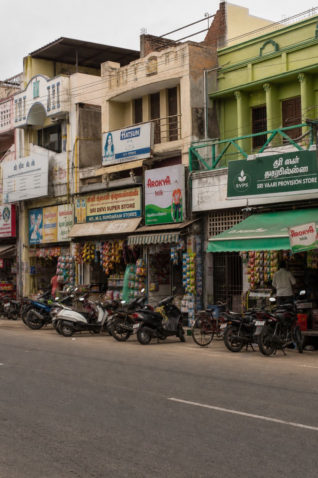 A row of small shops along a Chennai street.